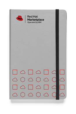 A notebook with the Red Hat Marketplace, Operated by IBM logo and a pattern of Red Hat icons printed on the front.